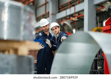 industrial-engineers-discuss-production-plan-260nw-2807189929